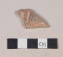 Red bodied earthenware body sherd, with brown slipped decoration