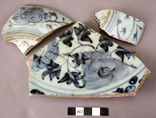 Rim and base potsherds belonging to one or two blue and white vessels