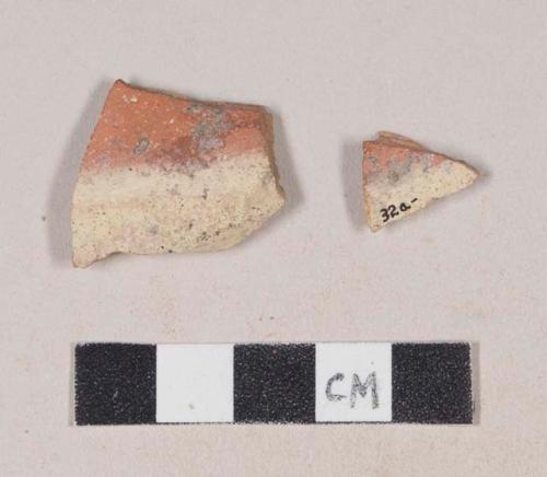 Red bodied earthenware body sherds, with red and white slip; two sherds crossmend