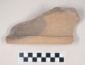 Coarse red bodied earthenware rim sherd, unslipped, reduced core