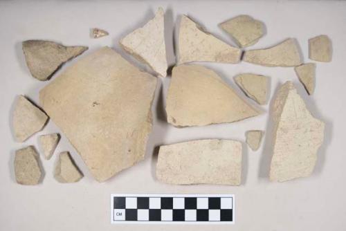 Coarse buff bodied earthenware body sherds, with buff slip; two sherds crossmend; two sherds crossmend; two sherds crossmend; three sherds crossmend; four sherds crossmend