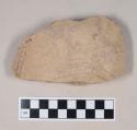 Coarse buff bodied earthenware body sherd, unslipped, with incised decoration