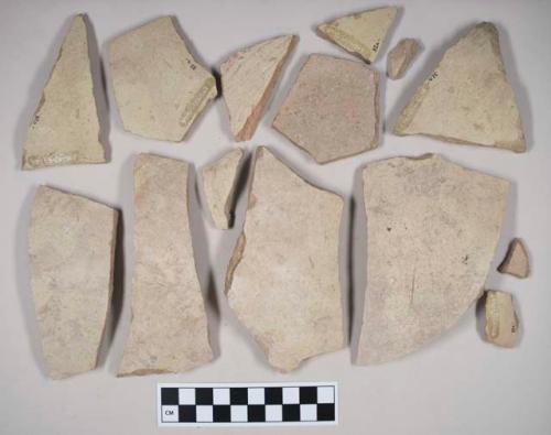 Coarse red bodied earthenware body sherds, with buff slip; two sherds crossmend; two sherds crossmend; two sherds crossmend