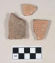 Coarse red bodied earthenware body sherds, with red slip, reduced core