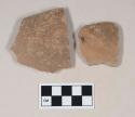 Coarse red bodied earthenware body sherds, with brown slip, reduced core