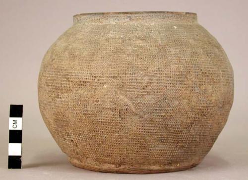 Gray stamped pottery jar with slight rim (bottom gone)