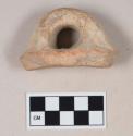 Coarse red bodied earthenware body and handle sherd, with buff slip