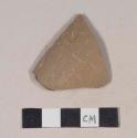 Red bodied earthenware body sherd, with brown slip, reduced core, wheel thrown