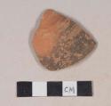 Red bodied earthenware body sherd, with black and red slip, wheel thrown