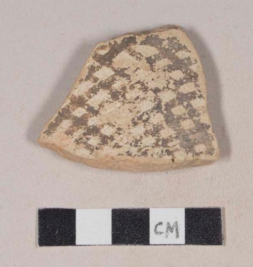 Coarse red bodied earthenware body sherd, with buff slip and brown slipped design