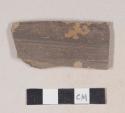 Gray bodied earthenware body sherd, with brown slip, wheel thrown