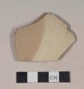 Brown bodied earthenware body sherd, with brown and buff slip, wheel thrown