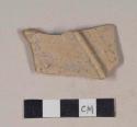 Molded red bodied earthenware body sherd, with buff slip