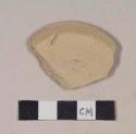 Buff bodied earthenware base sherd, unslipped, wheel thrown