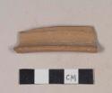 Red bodied earthenware rim sherd, unslipped, reduced core, wheel thrown