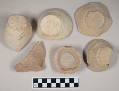 Coarse red bodied earthenware base sherds, with buff slip, wheel thrown