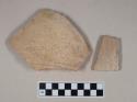 Molded coarse red bodied earthenware body sherds, with buff slip