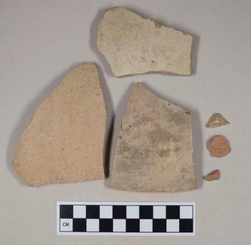 Coarse red bodied earthenware body sherds, with buff slip