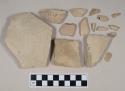 Coarse buff bodied earthenware body sherds, with buff slip; two sherds crossmend