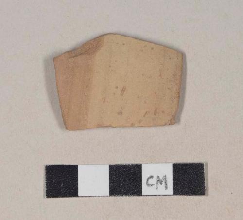 Red bodied earthenware rim sherd, with partial buff slip, wheel thrown