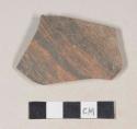 Gray bodied earthenware body sherd, with red and black slip, wheel thrown