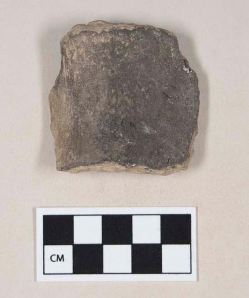 Coarse brown bodied earthenware body sherd, unslipped, blackened interior