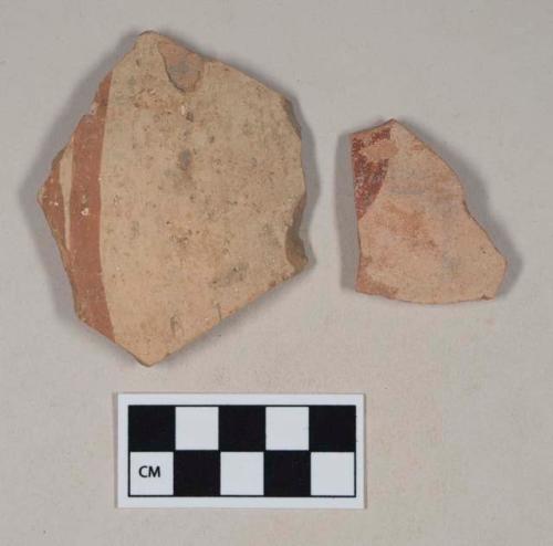 Red bodied earthenware body sherds, with buff slip and red slipped stripes