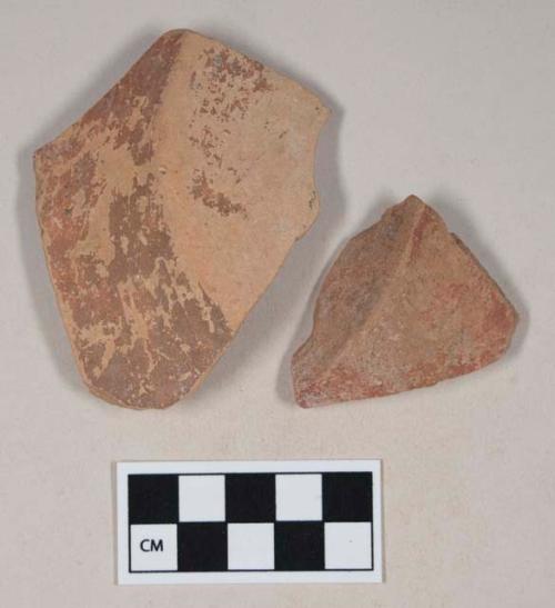 Red bodied earthenware base sherds, with red slip