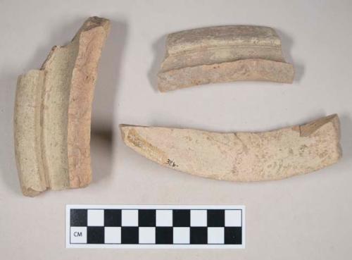 Coarse red bodied earthenware rim sherds, with buff slip