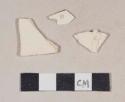 Undecorated creamware body sherds; two sherds crossmend