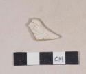 White salt glaze stoneware rim sherd with molded "dot, diaper, and basket" pattern