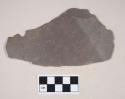 Slate roof tile fragment, with possible nail hole