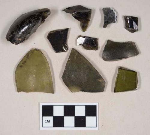 Olive green bottle glass fragments, including one base fragment