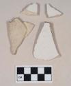 Undecorated ironstone body sherds; three sherds crossmend