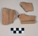 Coarse red bodied earthenware rim sherds, unslipped, reduced core