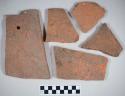 Redware roof tile fragments, some with nail holes