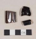 Undecorated, lead glazed redware handle sherds; two sherds crossmend