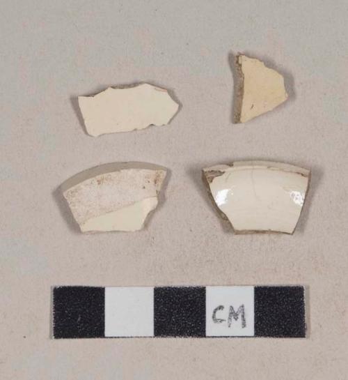 Undecorated creamware base sherds; three sherds crossmend