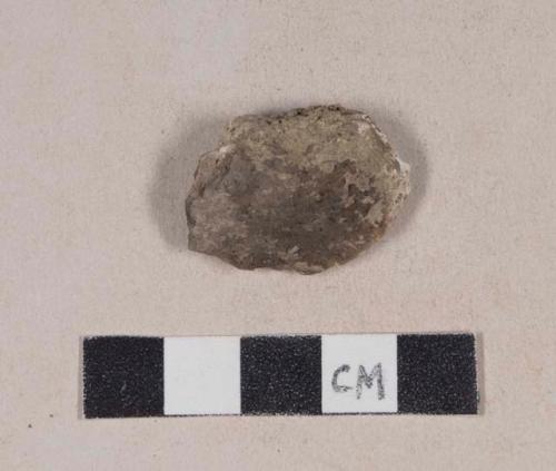 Mortar fragment, possibly partially burned