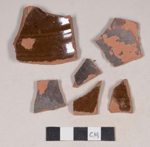 Undecorated, lead glazed redware body sherds; three sherds crossmend