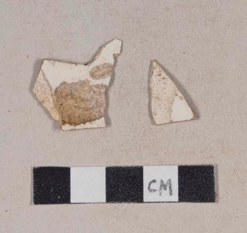 Undecorated creamware body sherds; two sherds crossmend