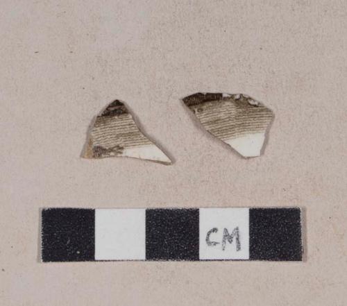 Brown transfer printed whiteware body sherds; two sherds crossmend