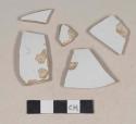 Undecorated ironstone body sherds; two sherds crossmend