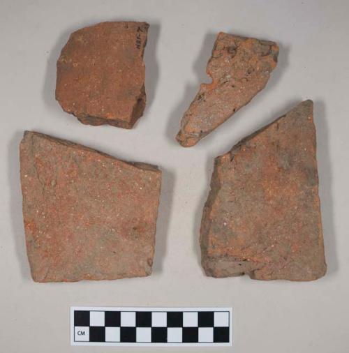 Redware roof tile fragments, one with nail hole