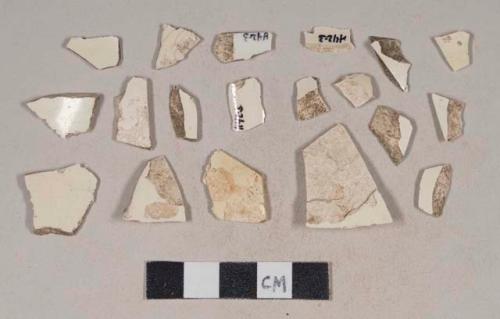 Undecorated creamware body sherds; two sherds crossmend