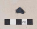 Burned, blue decorated refined earthenware body sherd