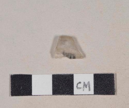 Folded colorless glass rim fragment, possible stemware base fragment