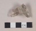 Colorless glass stemware fragment; possible molded letter on base