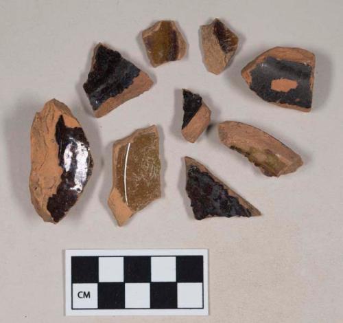 Undecorated, lead glazed redware base sherds; two sherds crossmend