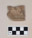 Burned, lead glazed redware base sherd